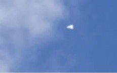 A triangular UFO was seen hovering in the skies over Amsterdam before taking off quickly