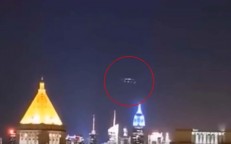 A UFO formation is seen on camera as a mysterious blue light floods New York at night