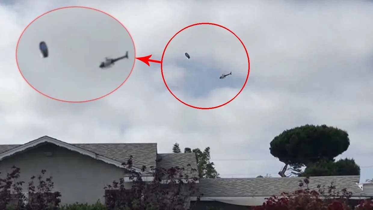 A UFO is intercepted by a Los Angeles police helicopter in shocking video that was shot over Los Angeles