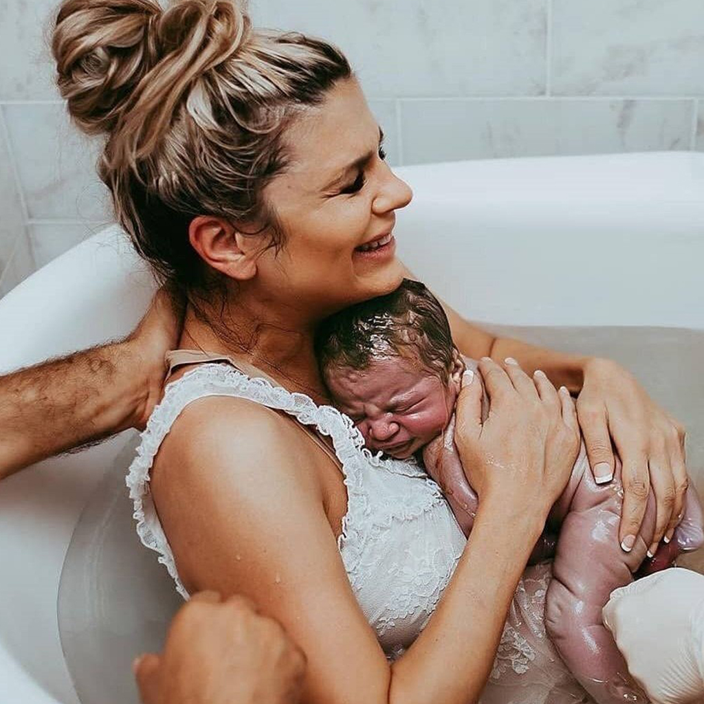 Beautifully unedited photographs depict mothers holding their newborns for the first time