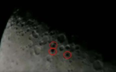 Three disk-shaped UFOs are photographed by an astronomer flying in formation in front of the Moon (UFO on moon)