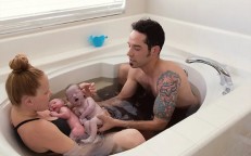 In a stunning new series of photographs, a father is seen delivering his twins during a water birth.