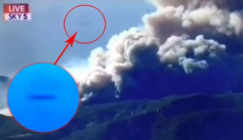A cigar-shaped UFO suddenly appears during a news report on California’s wildfires